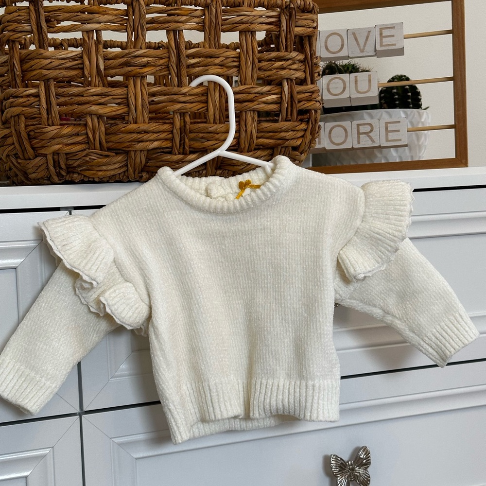 Baby sweater, worn once for a photo.